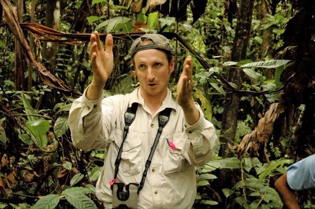 Brian Enquist conducting field measurements in a forest
